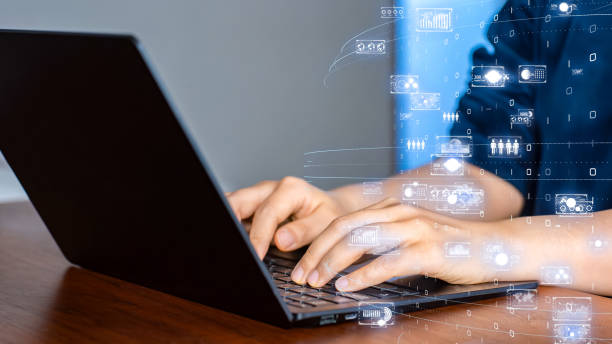 istock Corporate digital transformation, business executive using a laptop with futuristic data interface 2200288930