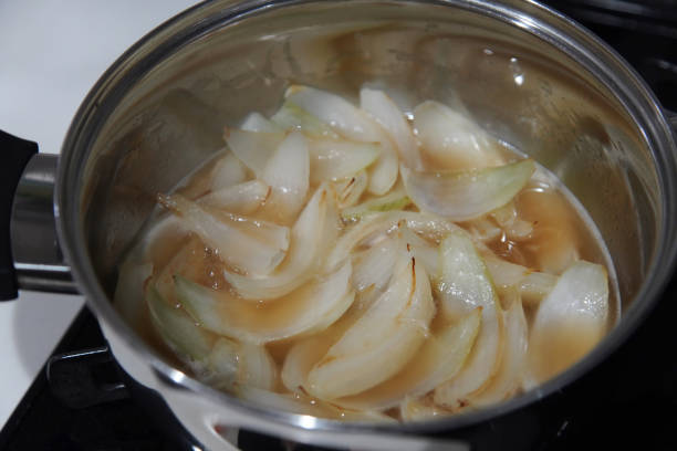 Image of onions being simmered in a pot