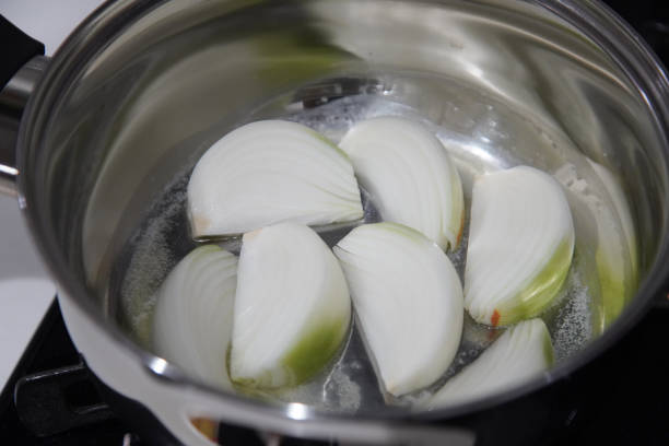 istock Image of onions being fried in a pan 2200303826