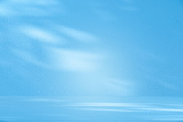 istock Studio style background wall decoration presentation uses white and blue tones. with shadows cast from a nearby window, concept creating a decorative 2200304906