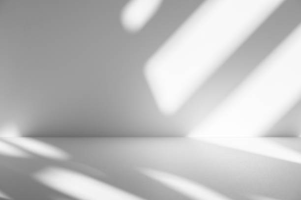 istock Wall interior background, studio and backdrops show products.with shadow from window color white . background for text insertion and presentation product 2200304911