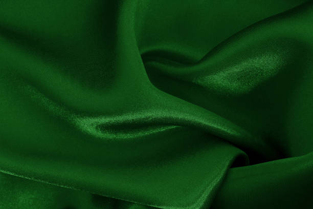 istock Dark green fabric cloth texture for background and design art work, beautiful crumpled pattern of silk or linen. 2200304917
