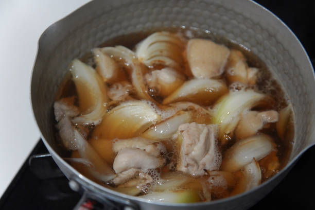 istock Cooking stewed chicken thighs and onions 2200305594