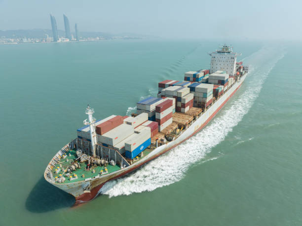 istock Cargo container ship passing Xiamen city, China 2200307248
