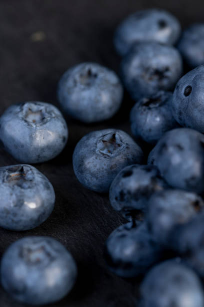 istock a pile of blueberries scattered on the board 2200307347