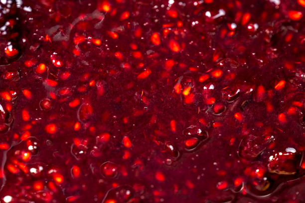 istock Crumpled sweet raspberries with added sugar 2200307435
