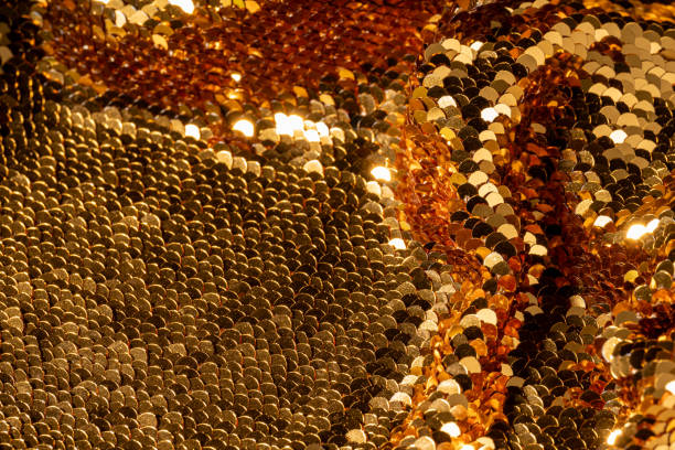 Gold sparkle glitter background. Glittering sequins textile drapery. Showcase for product , mockup
