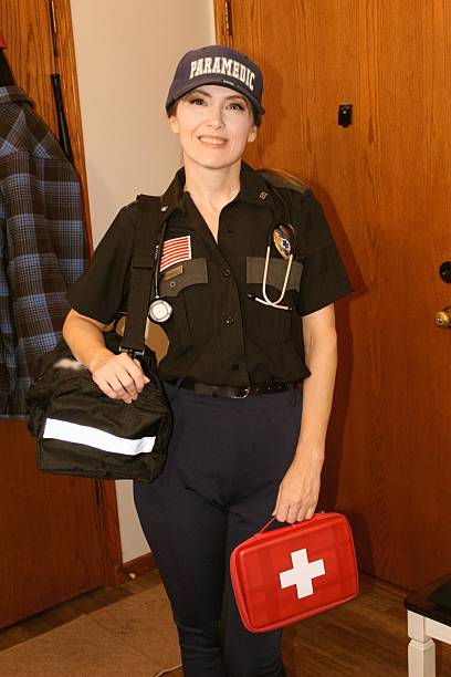 istock cute smiling female paramedic EMT 2200315592