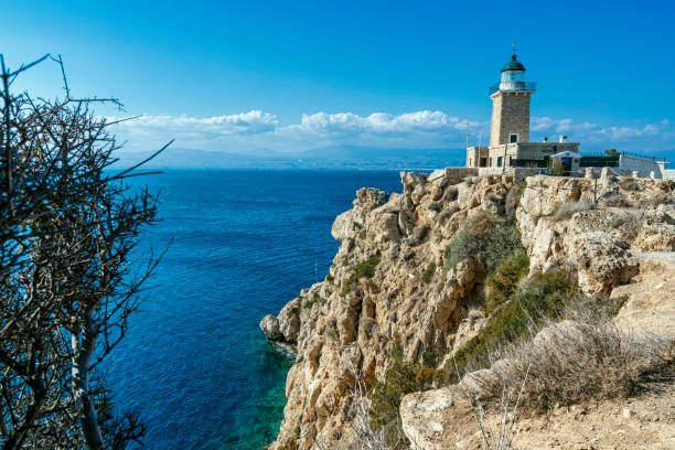 istock Lighthouse Melagavi on Rocky Cliff Overlooking Sea 2200316656