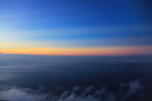 Blue sky clouds background, beautiful landscape with clouds and orange sun on sky.