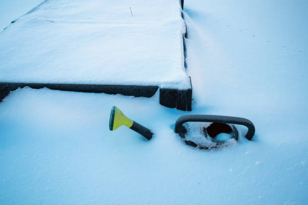 istock green plastic watering can in a garden covered in snow 2200320930