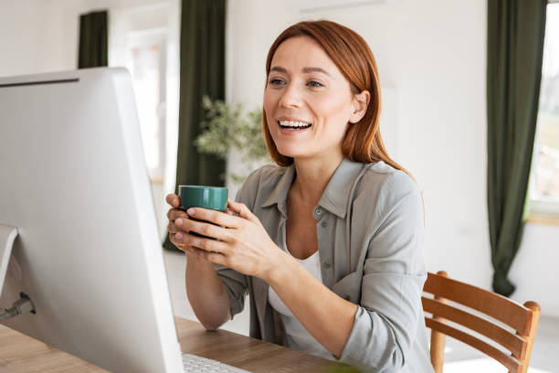 istock Woman Enjoying Coffee While Working at Home 2200329785