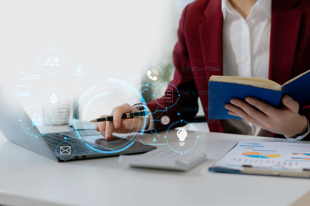 istock Copyright or patent concept, Person hand using laptop computer, tablet and smartphone with virtual screen copyright icon trademark, Creation ownership against piracy at office. 2200332045