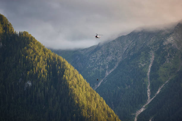 istock Helicopter rescue training simulation in a mountain range wood. Accident 2200332720