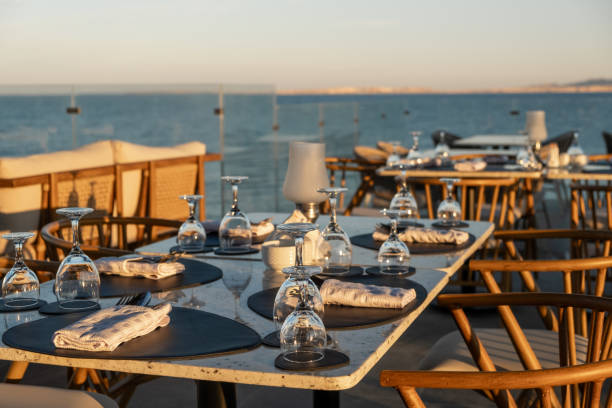 istock Beautifully arranged tables at a seaside restaurant with ocean views 2200335902