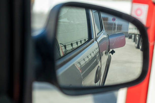istock A car's rear view mirror shows a red and white sign 2200336418