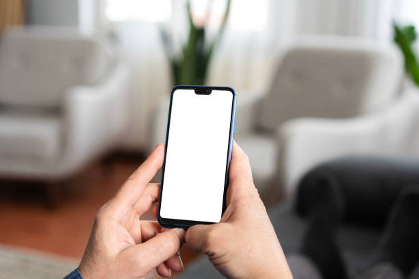 istock Senior Person using smartphone with blank screen at home 2200342210