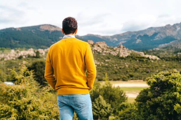 istock Man standing in beautiful landscape 2200342984