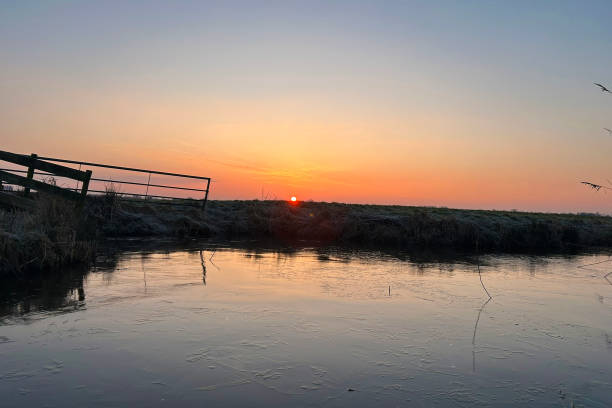 istock Sunrise on the meadow in the winter 2200343548