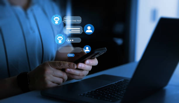 istock Businessman talking to a robot assistant.Contact us for online support. Customer service, helpdesk advice online chat support. 2200343962