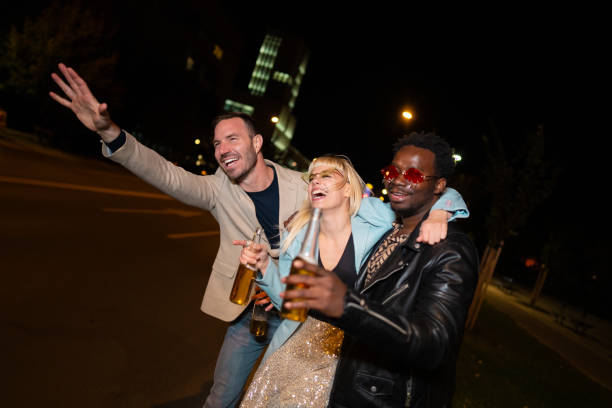 istock Friends celebrating on a night out . 2200345775