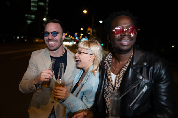 istock Friends celebrating on a night out . 2200345780