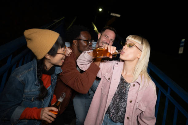 Four friends enjoying  their free time in the bar,drinking and having fun
