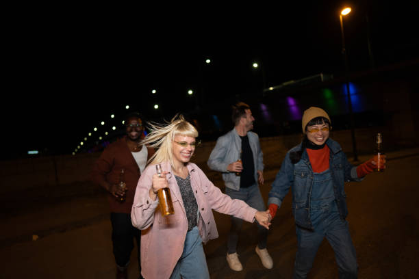 istock Friends celebrating on a night out. 2200346340