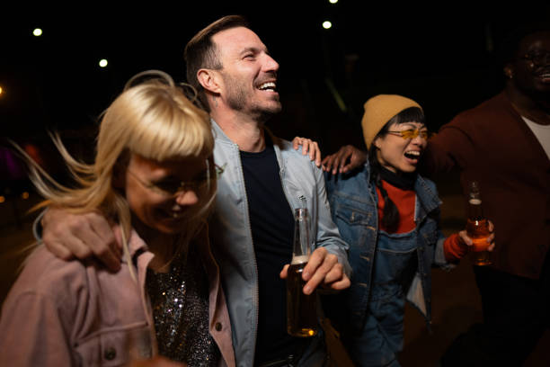istock Friends celebrating on a night out. 2200346391