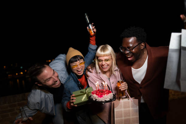istock Friends celebrating on a night out. birthday party. 2200346541