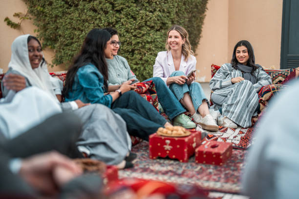istock Diverse Group Enjoying Social Gathering in Arabian Majlis 2200346882