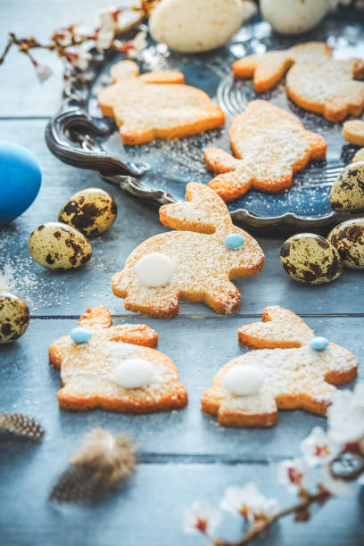 istock Homemade almond bunny cookies for Easter with Easter eggs in blue tone 2200348133