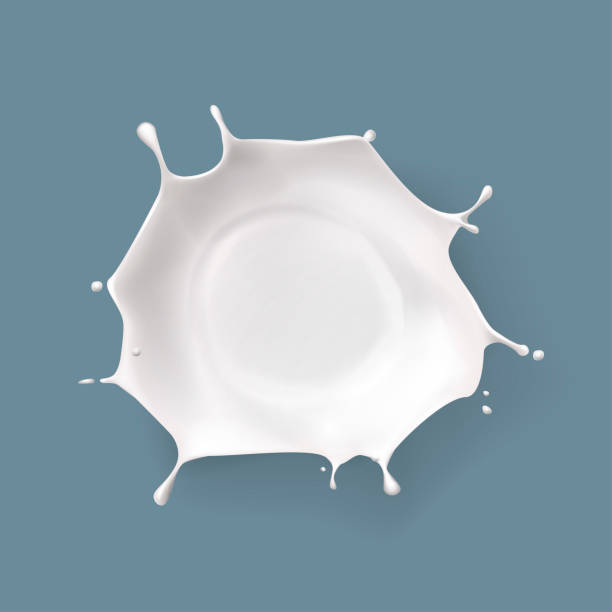 istock Splashed milk isolated. Natural dairy products, yogurt or cream in crown splashes with flying drops. 2200359361