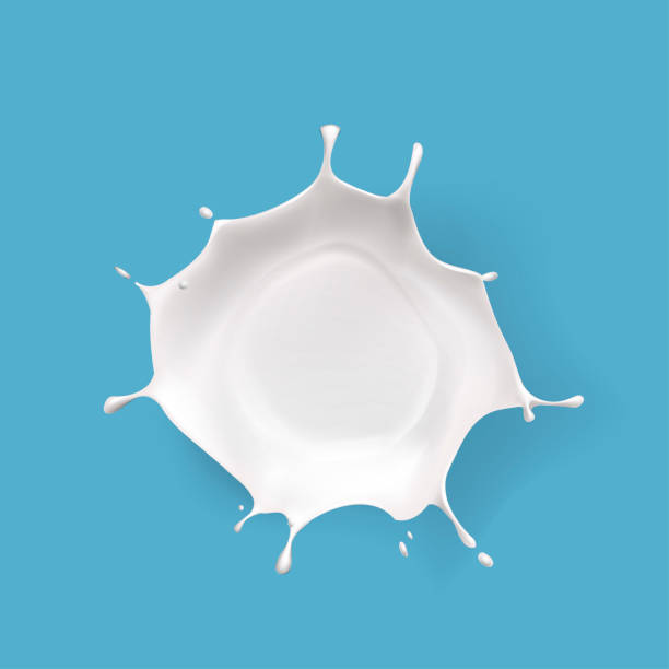 istock Splashed milk isolated. Natural dairy products, yogurt or cream in crown splashes with flying drops. 2200359378