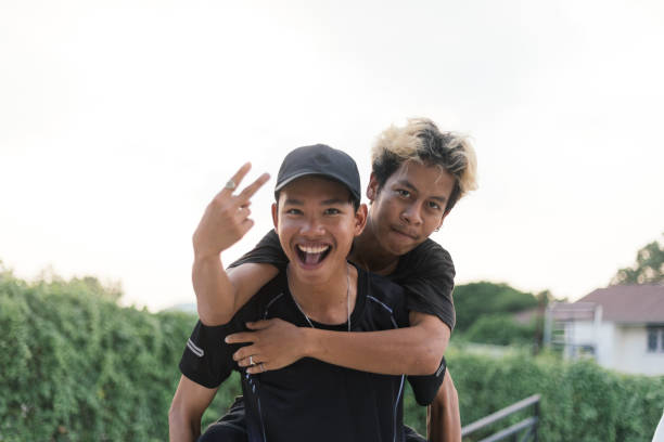 Best friends laughing and hopping on back.