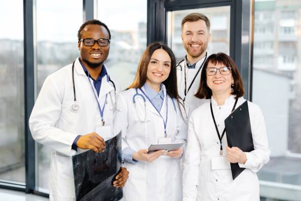 istock Group of doctors standing together in hospital setting 2200360316