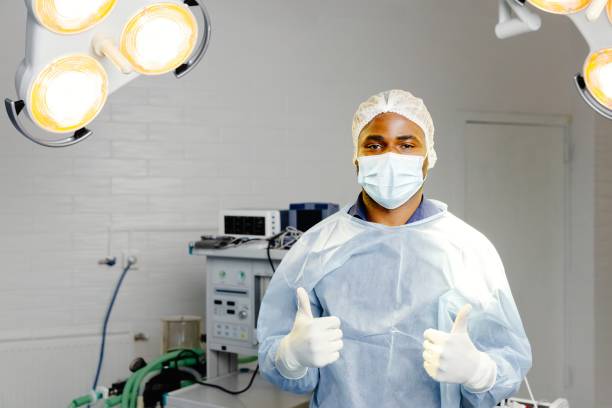 istock Man wearing surgical mask in hospital 2200360325