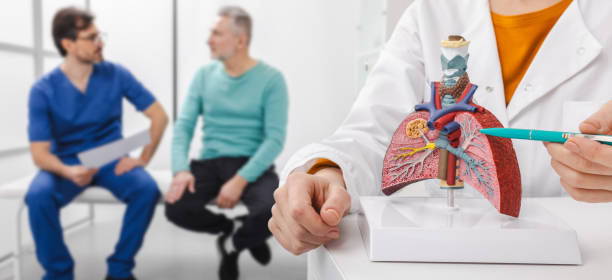 istock Pulmonologist explain lung health to a patient using anatomical model in a clinical setting, emphasizing treatment and care options 2200360622