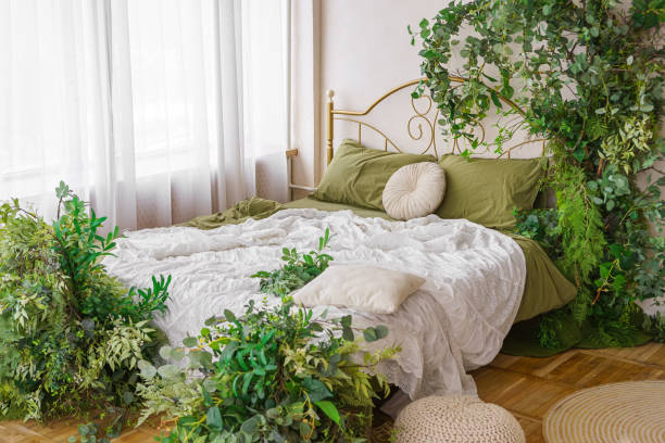 istock Cozy bedroom adorned with lush greenery and natural spring decor for tranquil atmosphere 2200361029