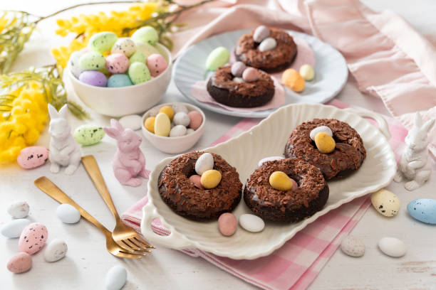 istock Baked chocolate donuts with chocolate shavings and Easter chocolate eggs 2200362775