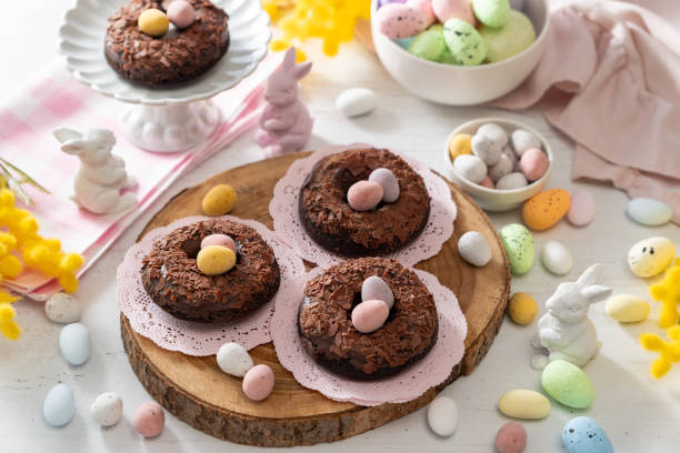 istock Baked chocolate donuts with chocolate shavings and Easter chocolate eggs 2200362778