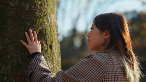 istock Woman Connecting with Nature Through Grounding 2200365436