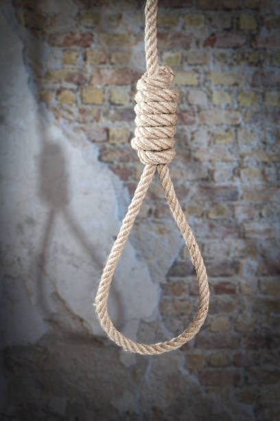 istock Hanging rope against weathered brick wall 2200368060