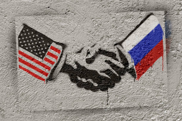 istock Stencil art depicting us-russia handshake on wall 2200368067