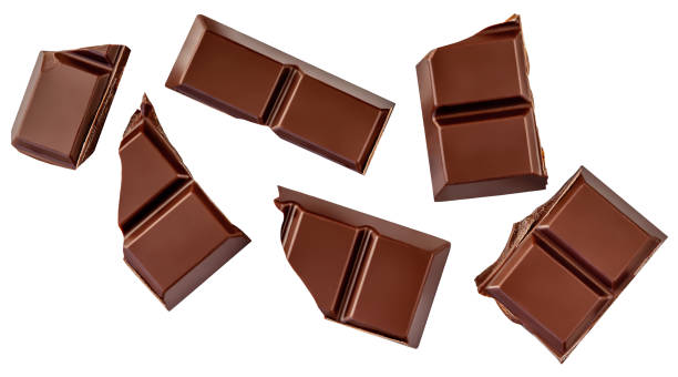 istock Falling Milk chocolate bar pieces isolated on white. Dark chocolate flying, top view.  Chocolate bar pieces  levitating. Package design element 2200368347