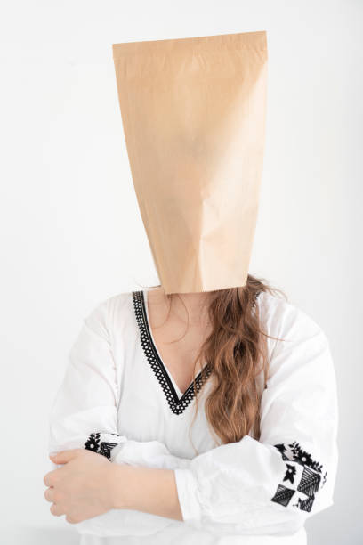 Woman wearing a paper bag.