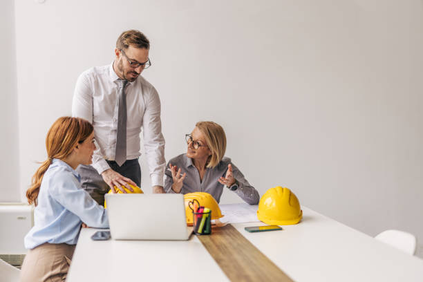 Architects having a meeting in the office discussing a project
