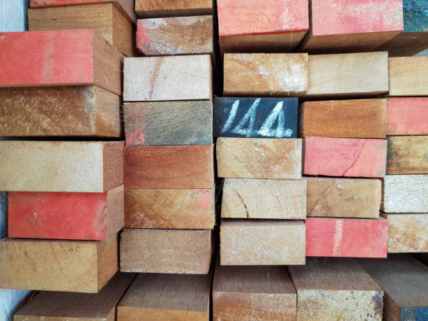 istock Vibrant wooden planks numbered and stacked, forming geometric pattern in thai lumber workspace, showcasing woodworking organization 2200371933