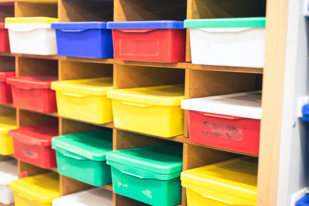istock Colorful storage bins with lids classroom organization shelves at kindergarten class, Dallas, Texas, BPA free plastic stackable organizer box for teacher tool game, school supplies, modular drawer 2200372311