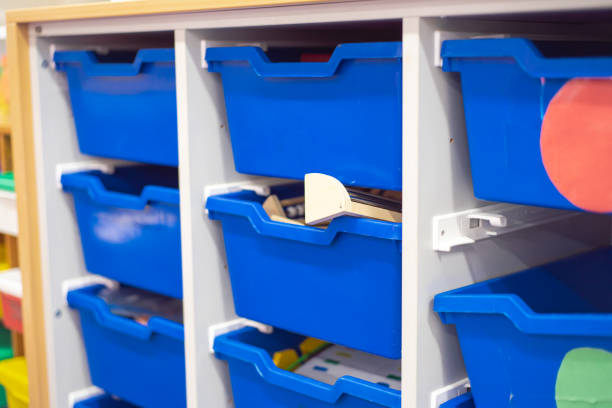 istock Blue drawer plastic storage bins for school supplies, teacher game tools, classroom organization shelves at kindergarten class in Dallas, Texas, tidy modular organizing, educational industry 2200372360
